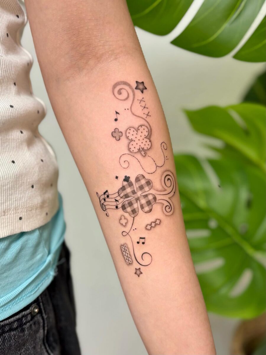 Charming and whimsical floral music tattoo