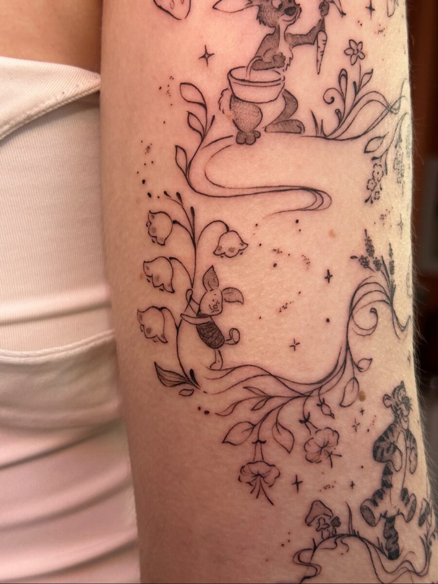 Charming Tattoos Featuring Playful Animals and Flora