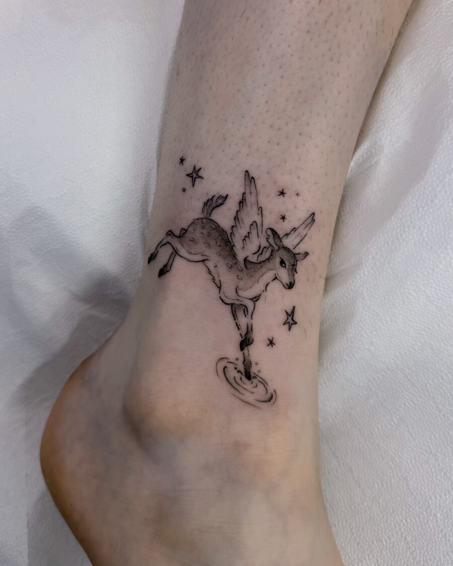 Magical unicorn tattoo with playful details