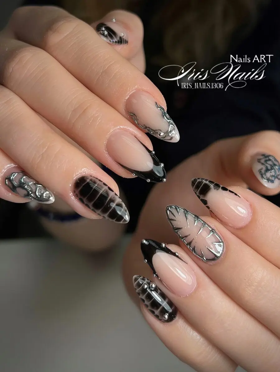 Futuristic black and silver nail art design