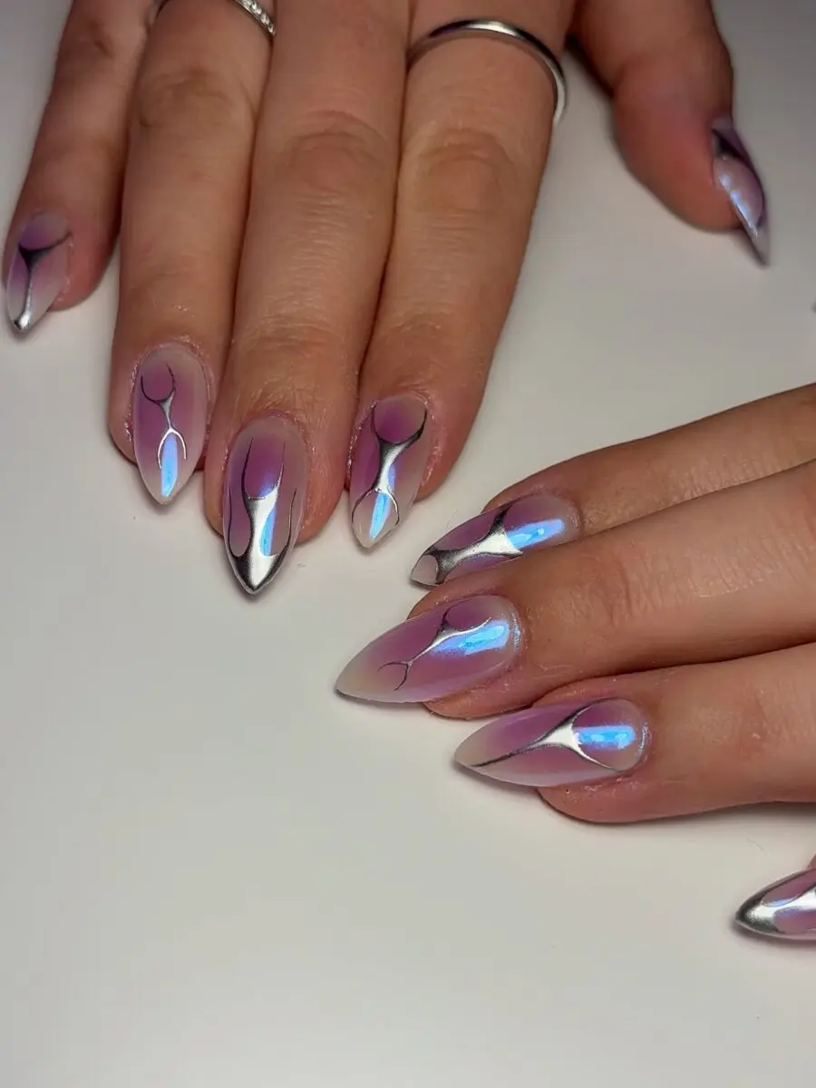 Futuristic Y2K nail art with metallic accents