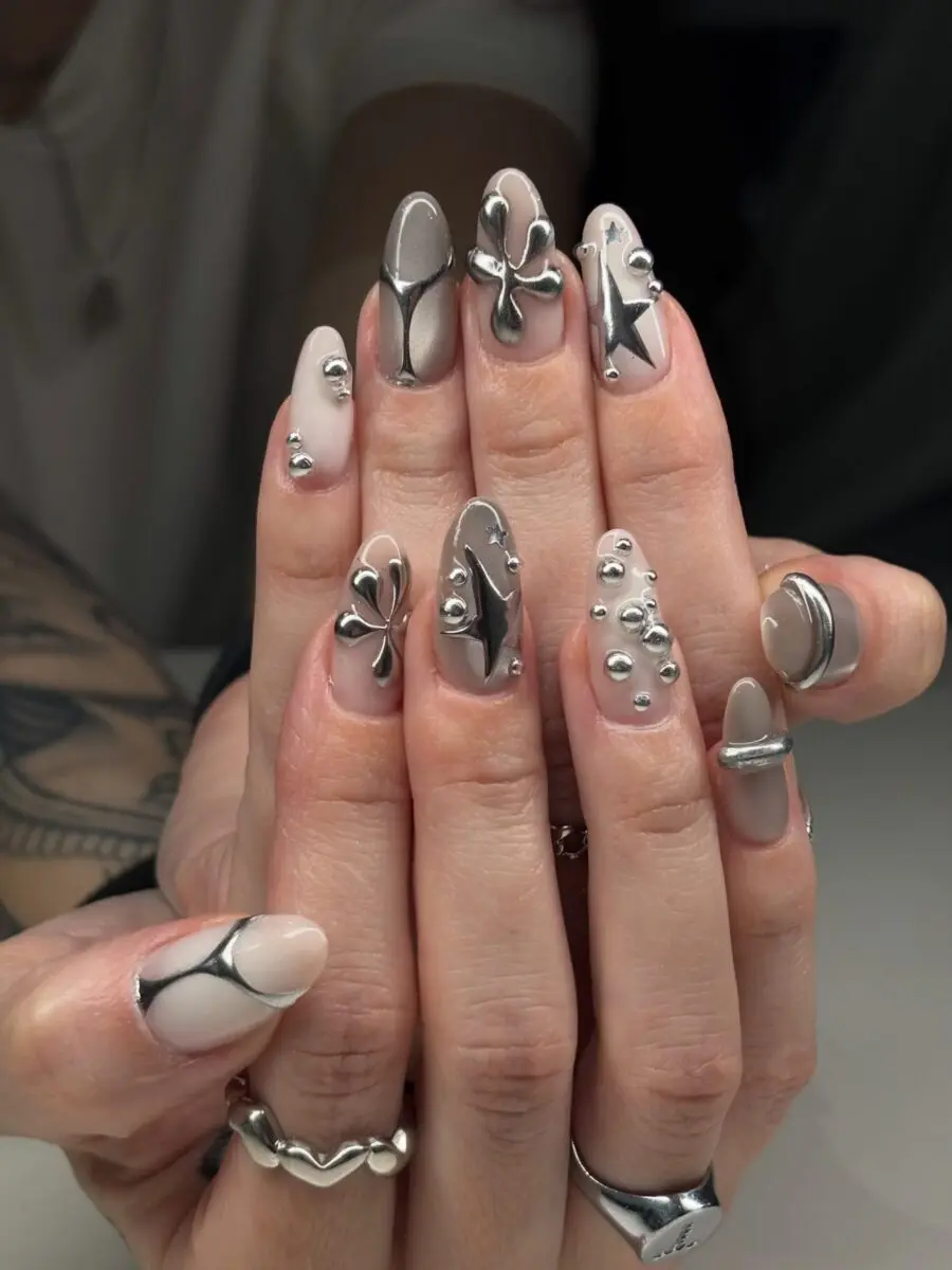 Chic Y2K-inspired nail art with metallic vibes