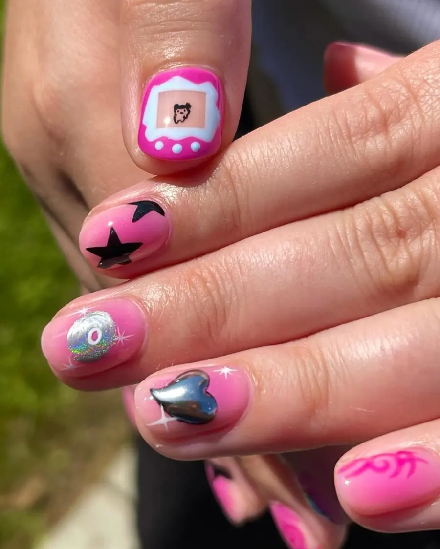 Charming pink Y2K nails with playful designs