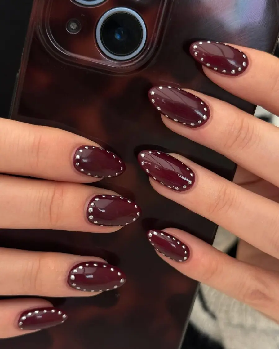 Elegant burgundy almond nails with nail art
