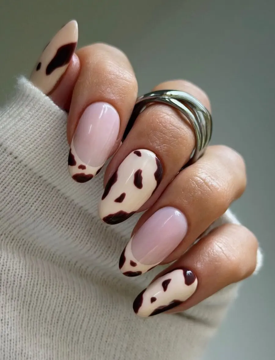 Chic Almond Nails with Cow Print Design