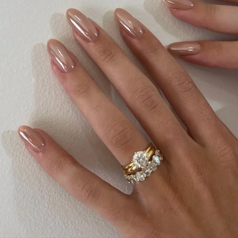 Elegant almond nails accentuated with rings