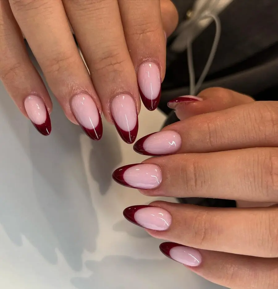 Elegant almond nails with bold red tips