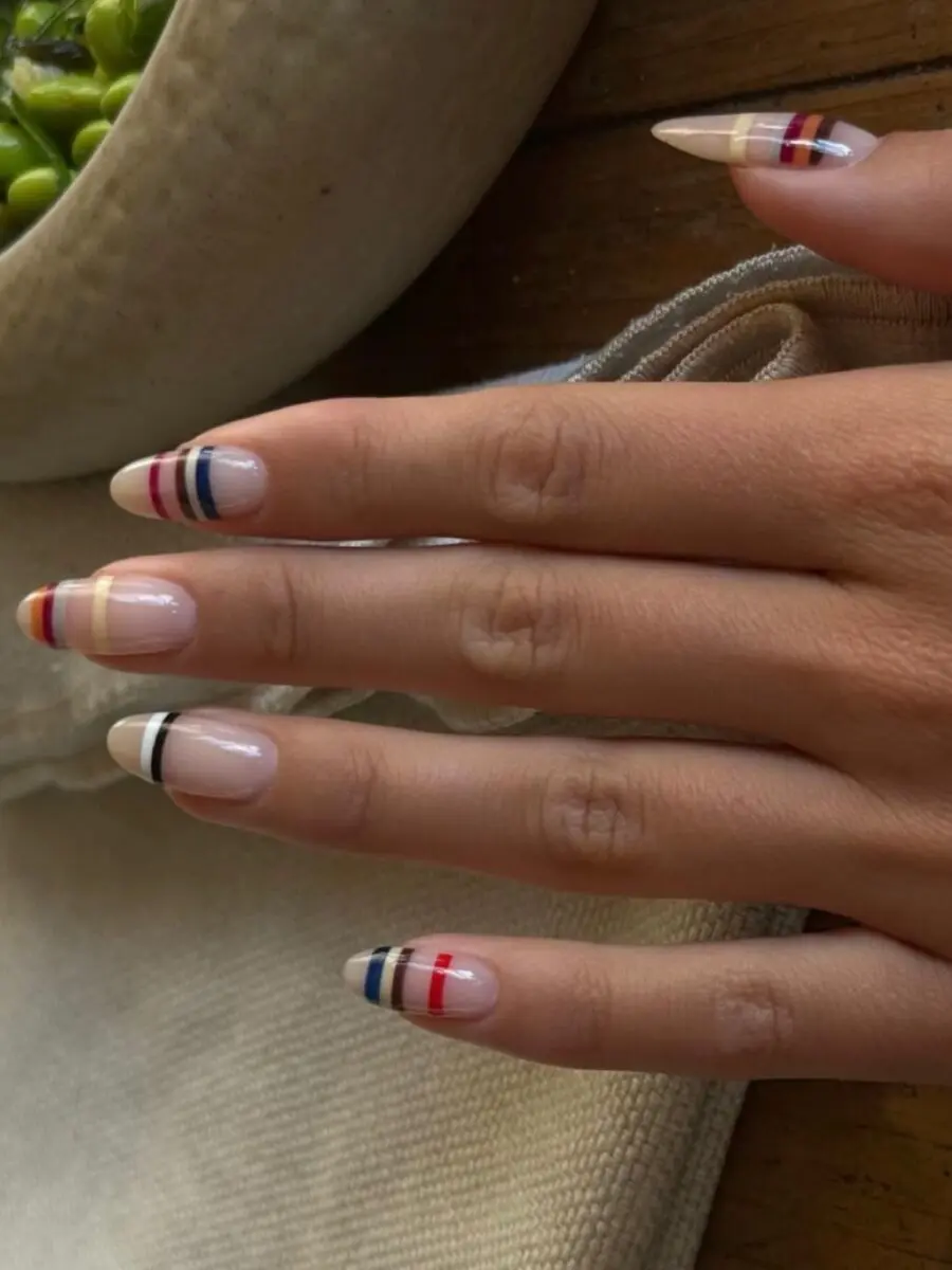Chic almond nails with bold stripe accents