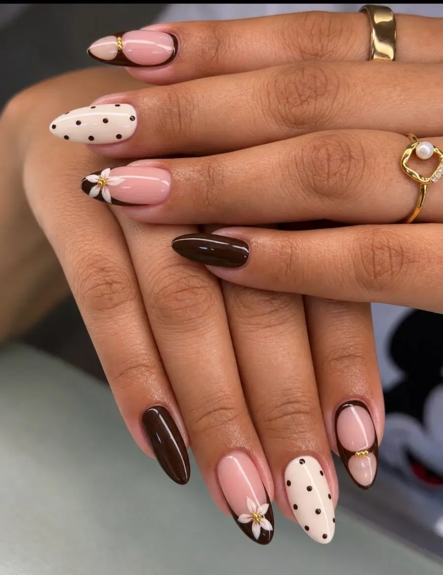 Stylish almond nails featuring floral and polka dots