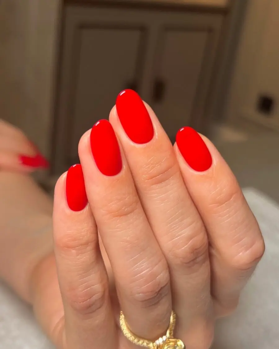Sleek almond nails in striking red shade
