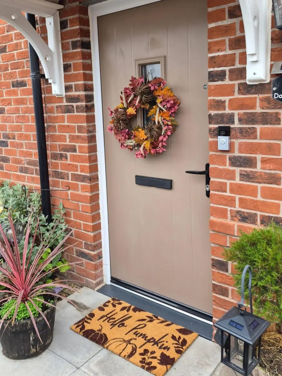 Charming autumn front door with welcoming vibes