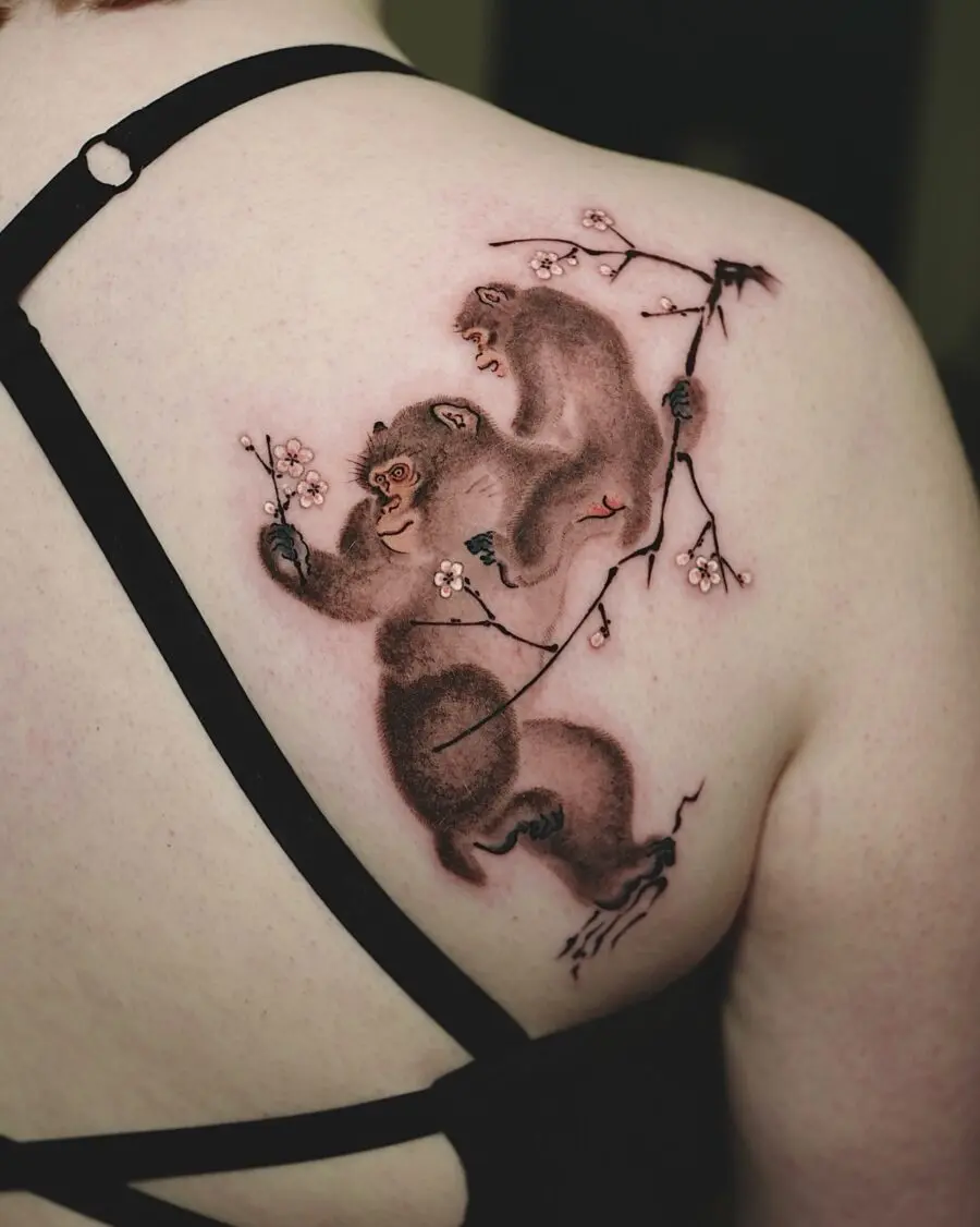 Dynamic bear tattoo with cherry blossoms