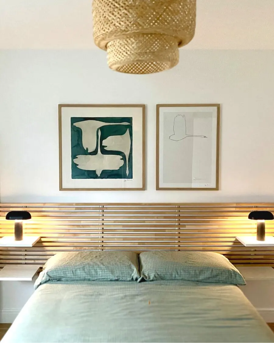 Elegant bed decor with modern artwork and lighting