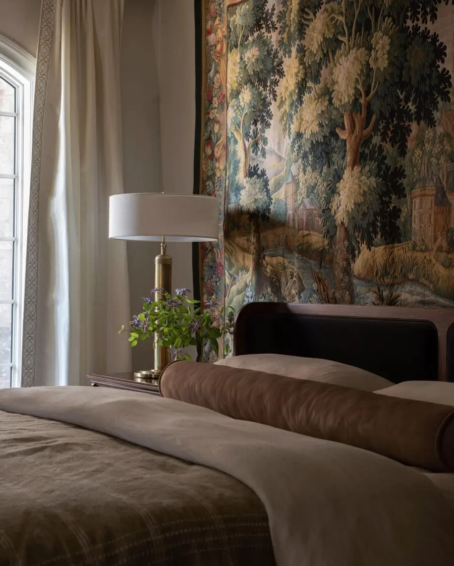 Charming vintage tapestry above a cozy bed