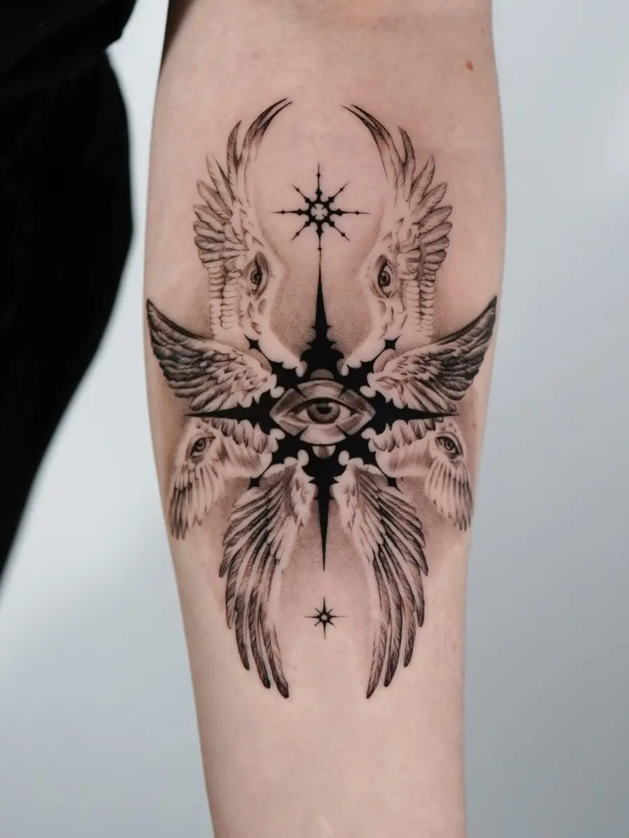 Intricate tattoo featuring wings and an eye