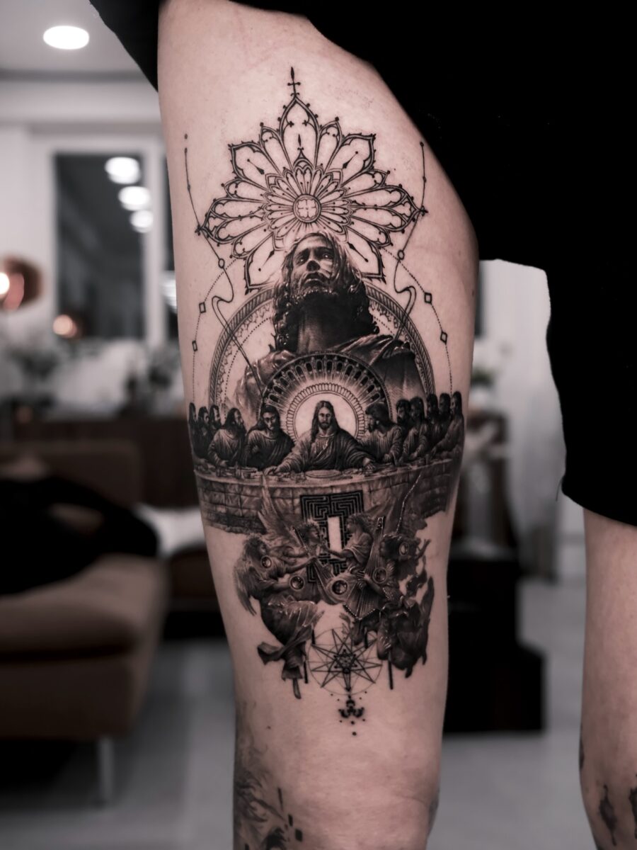 Intricate tattoo of Christ and religious motifs