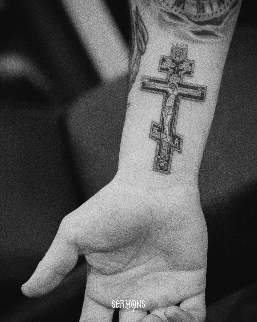 Intricate Cross Tattoo with Religious Symbolism