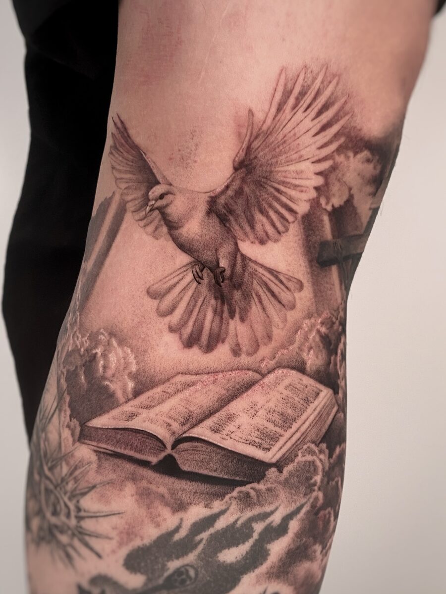 Symbolic tattoo blending faith and freedom