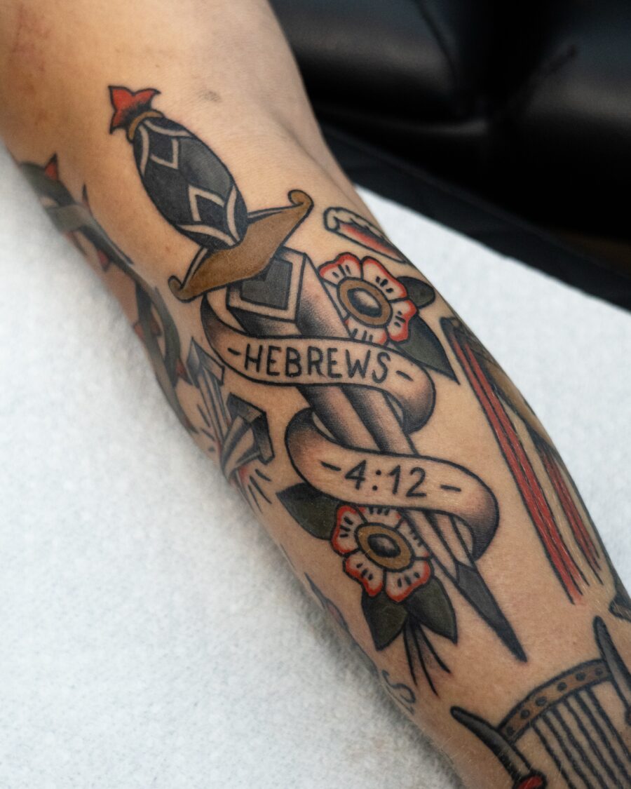 Stunning sword and floral biblical tattoo design