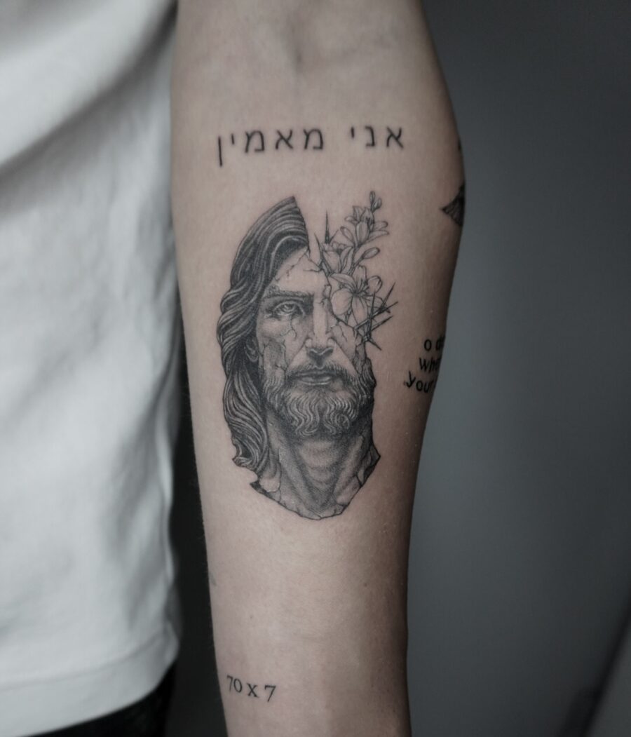 Striking Biblical Tattoo of Jesus with Flowers