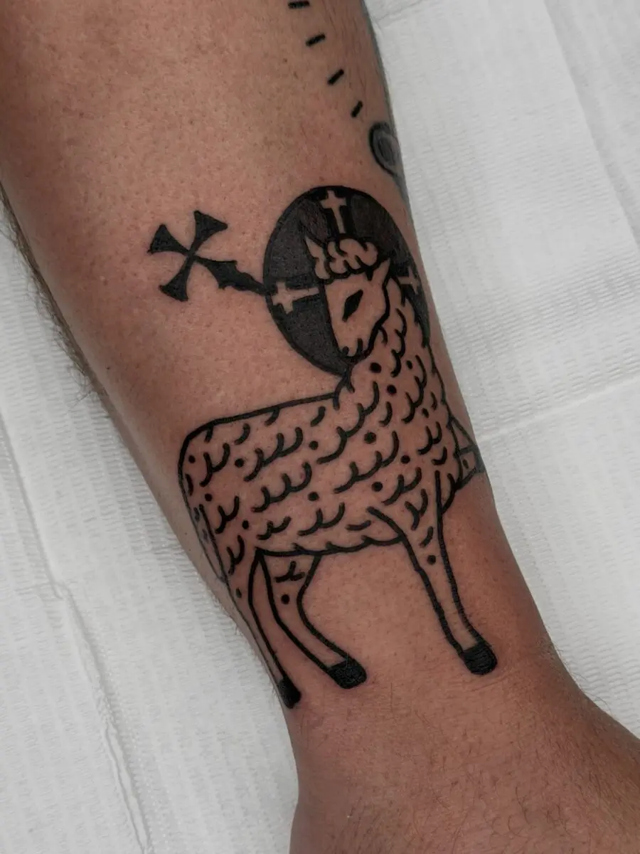 Iconic lamb design with Christian symbolism.