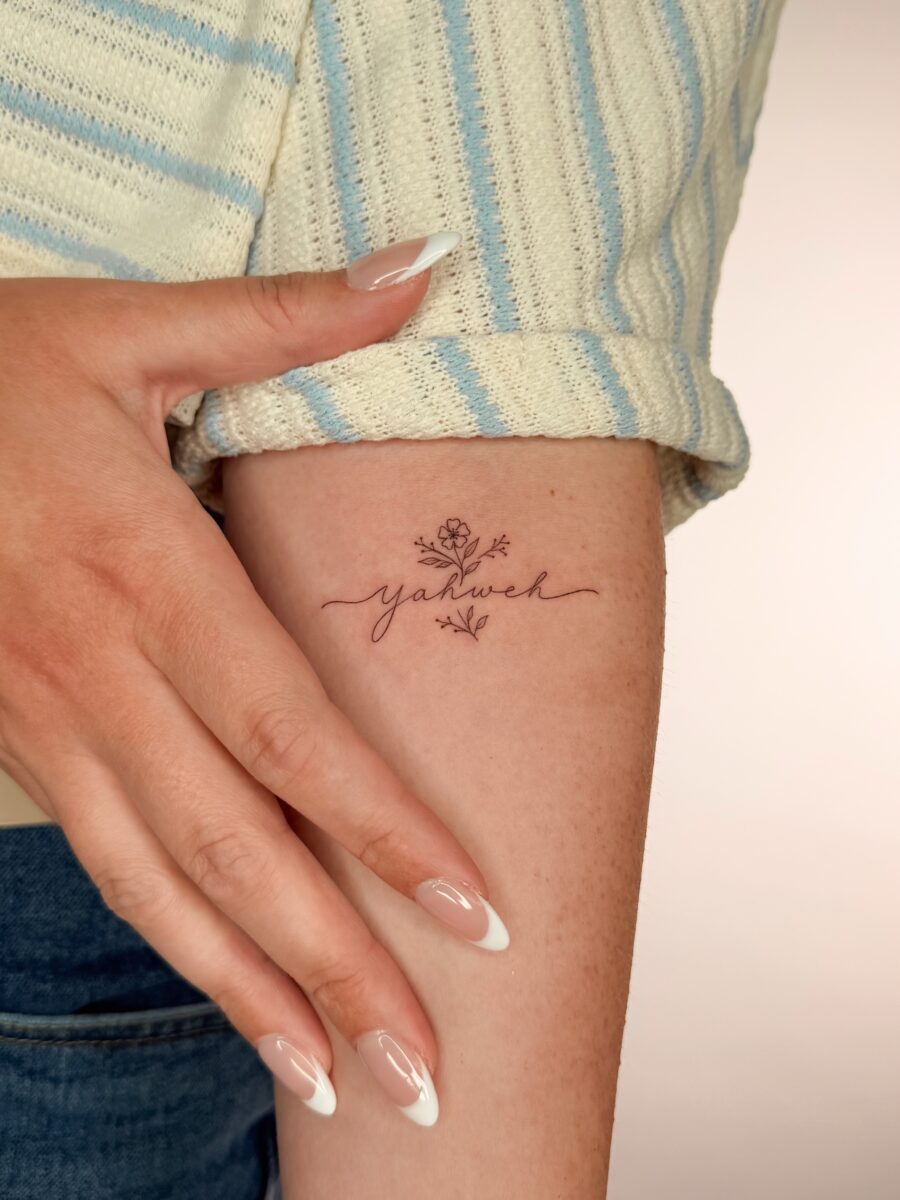 Delicate Yahweh Tattoo with Floral Touch