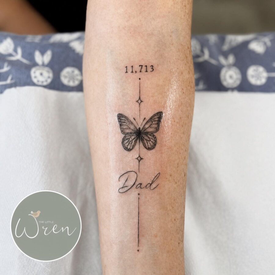 Elegant butterfly tattoo honoring a father’s memory