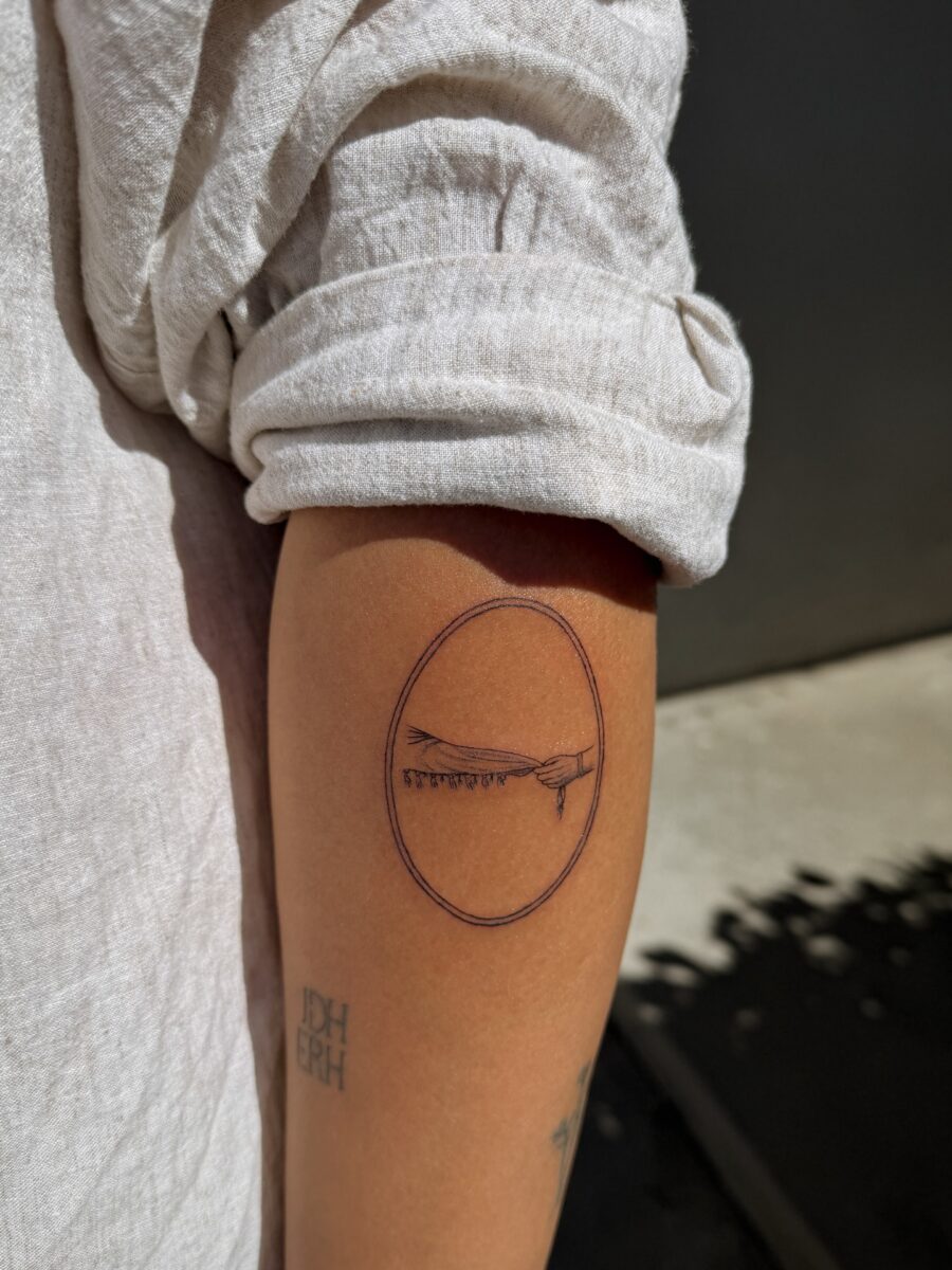 Symbolic tattoo featuring a dove and cross