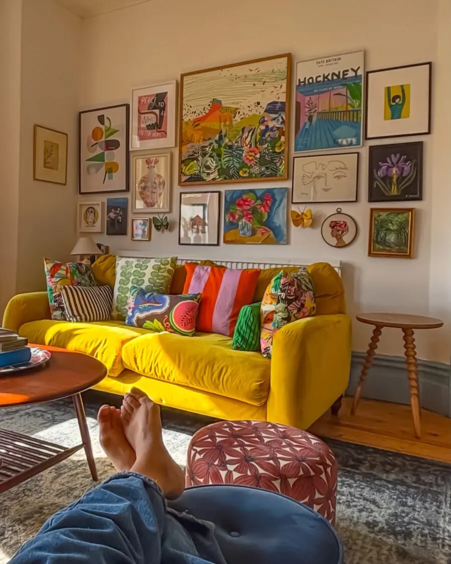 Vibrant Yellow Sofa Surrounded by Art