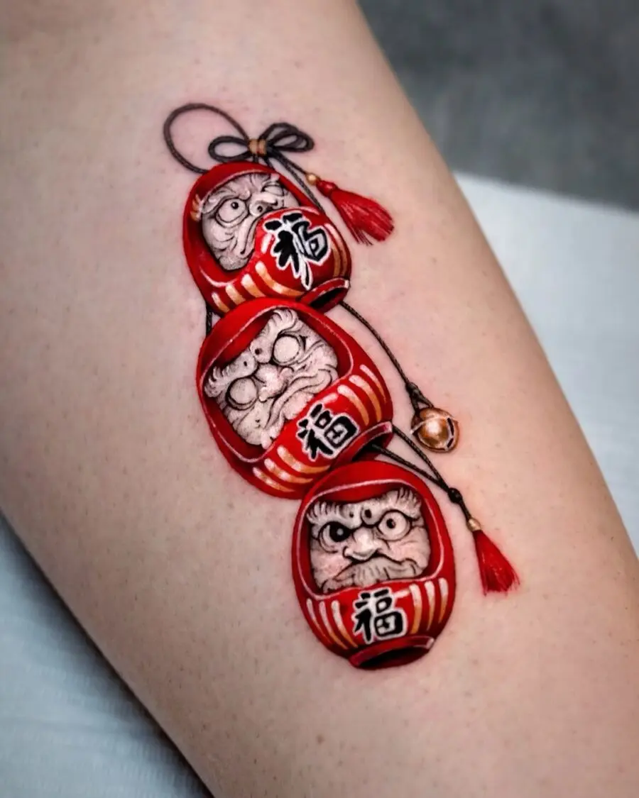 Vibrant Daruma Doll Tattoo Symbolizing Luck