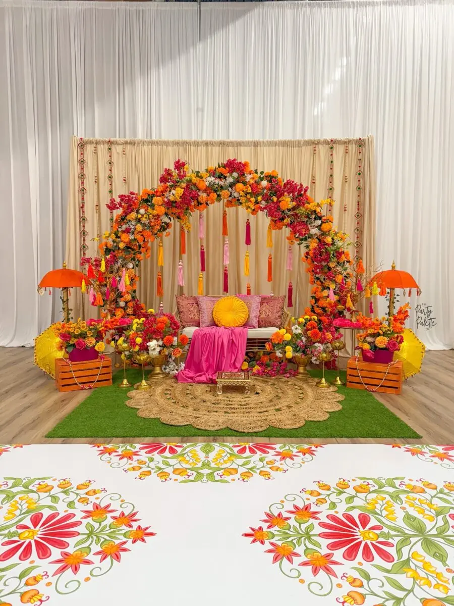 Vibrant Floral Arch with Cozy Seating
