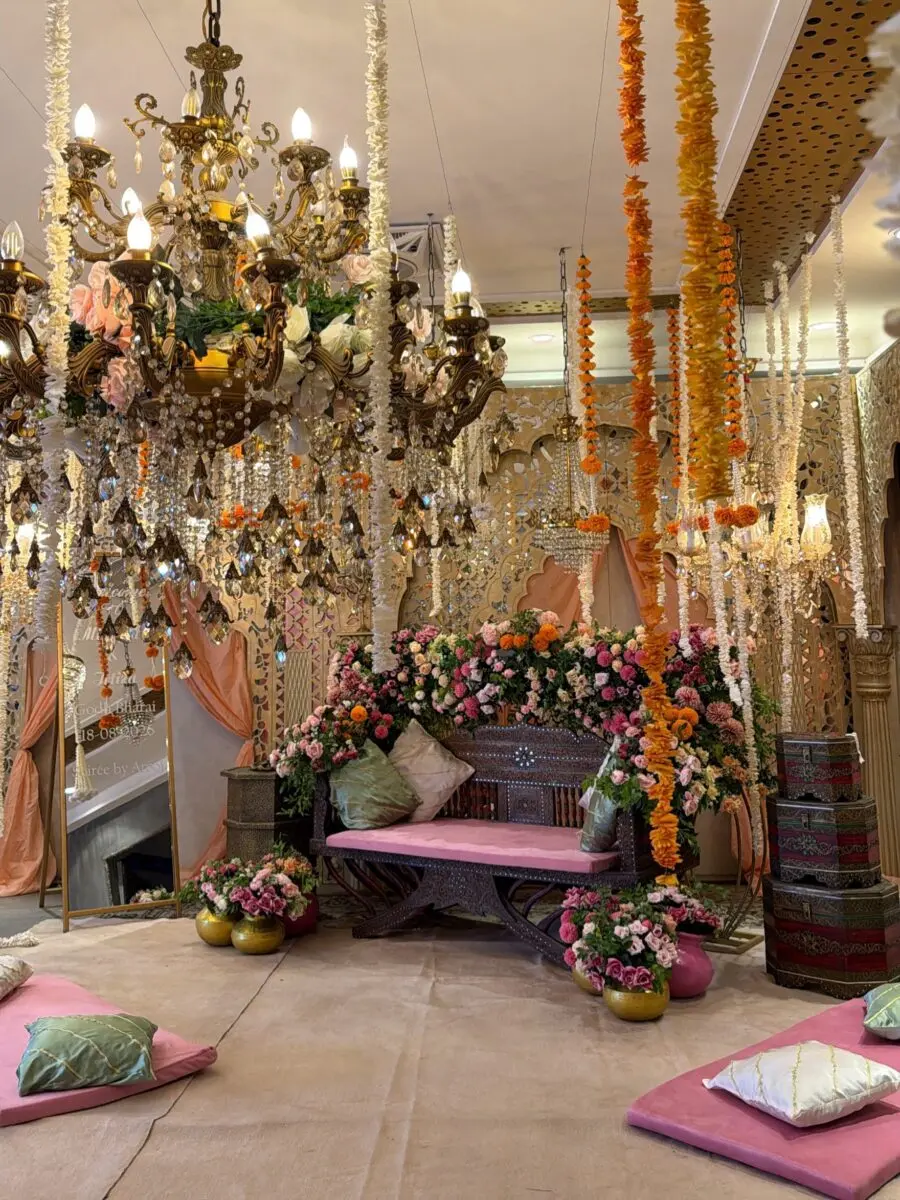 Vibrant floral arrangement with elegant chandelier