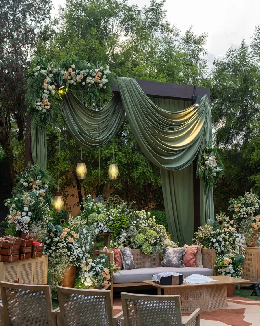 Elegant greenery adorns this cozy wedding nook