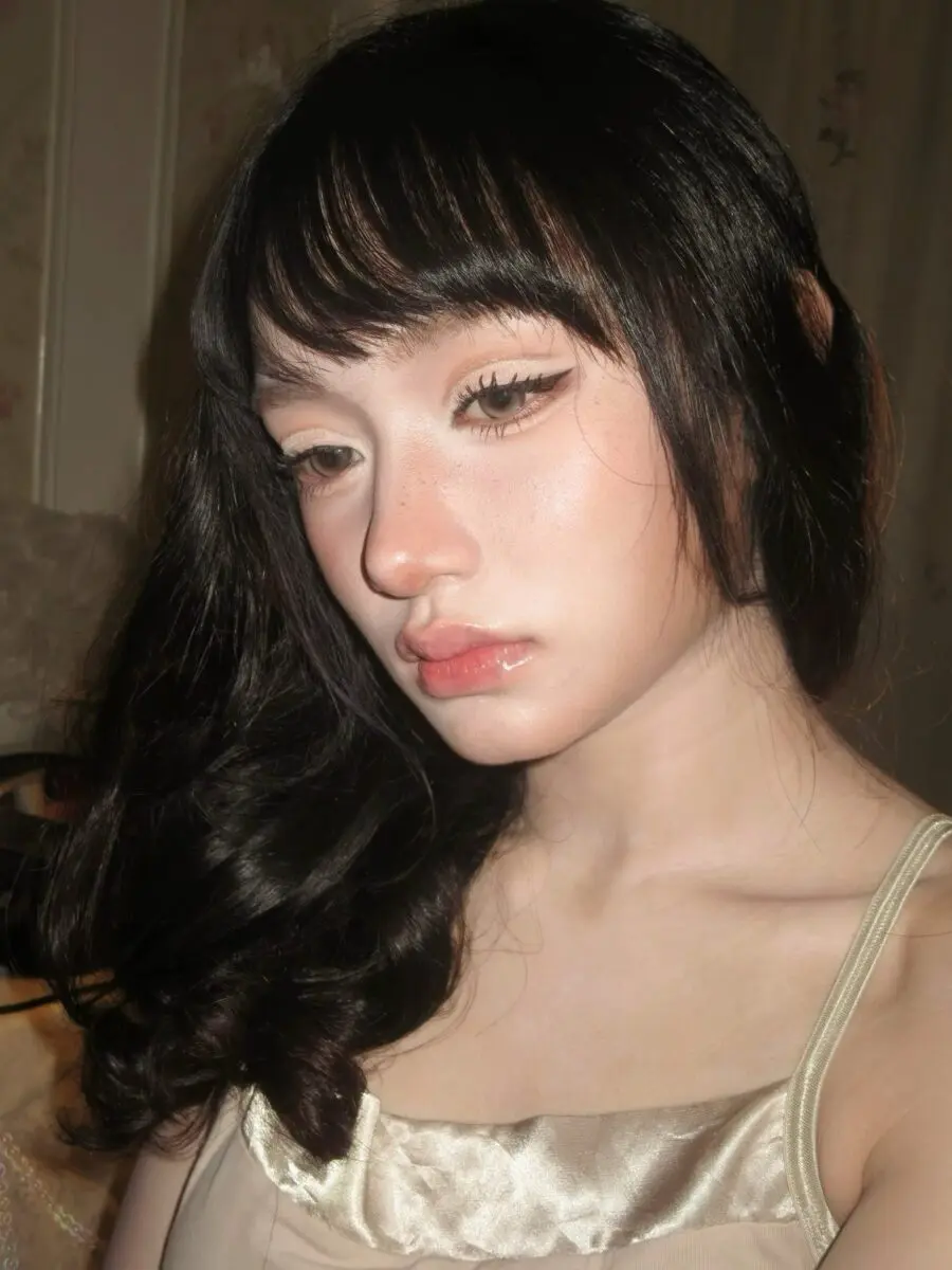 Glamorous doll makeup with glossy finish
