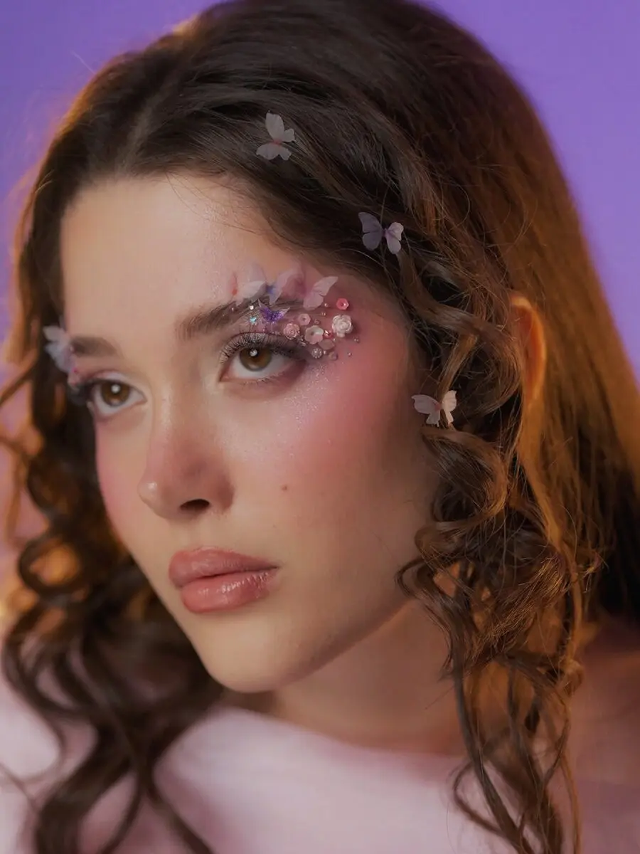 Whimsical butterfly-inspired doll makeup look
