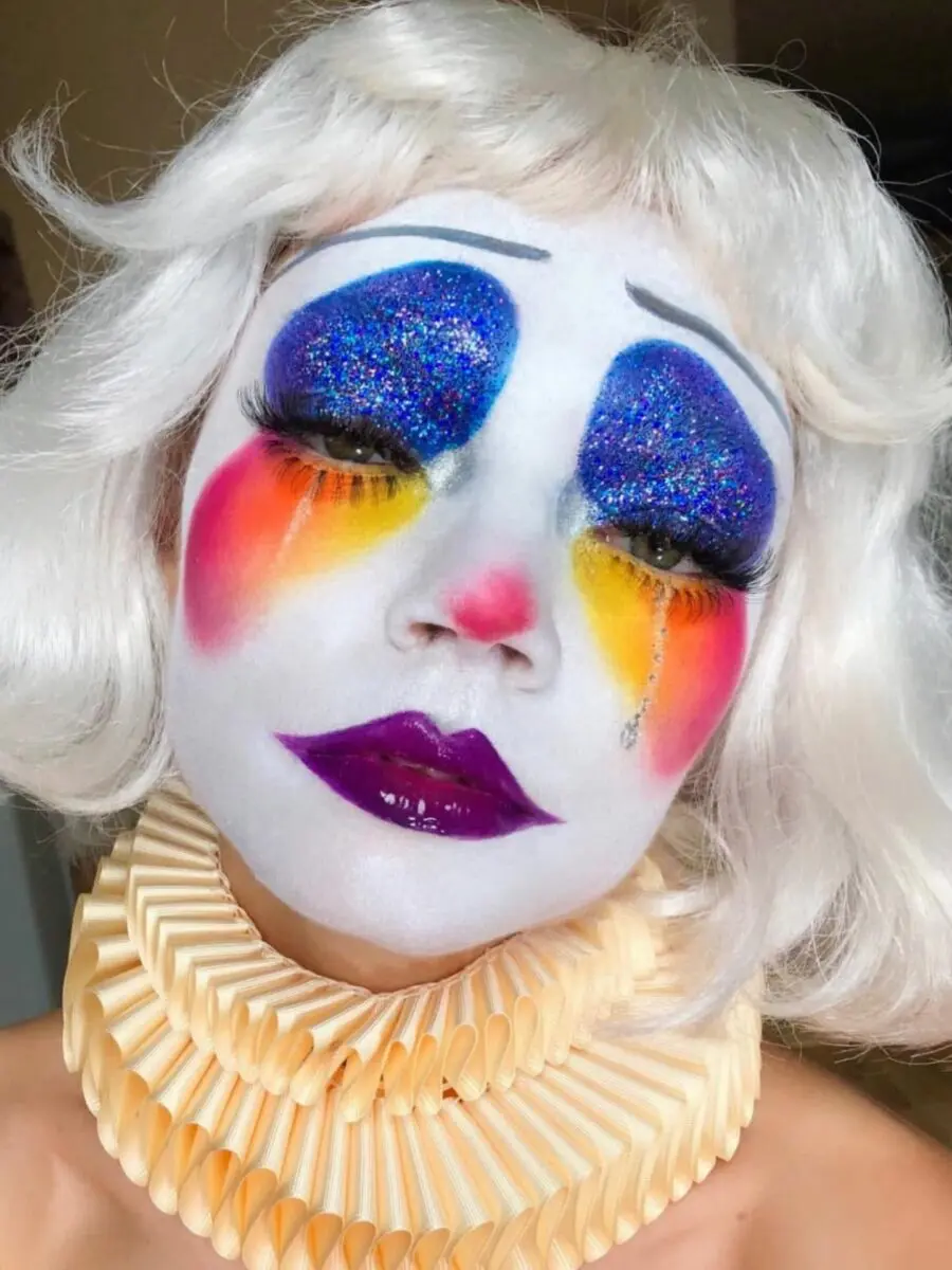 Bold clown-inspired makeup with vibrant colors