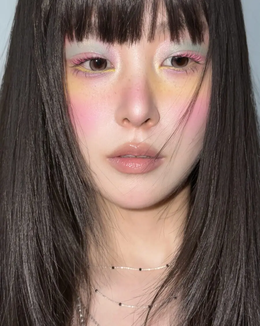 Vibrant pastel doll makeup with a soft glow