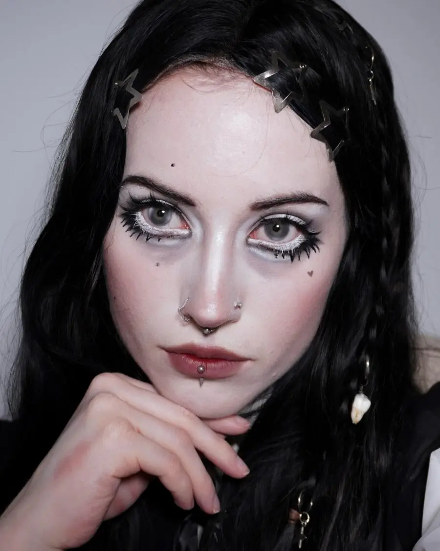 Chic doll makeup with a gothic touch