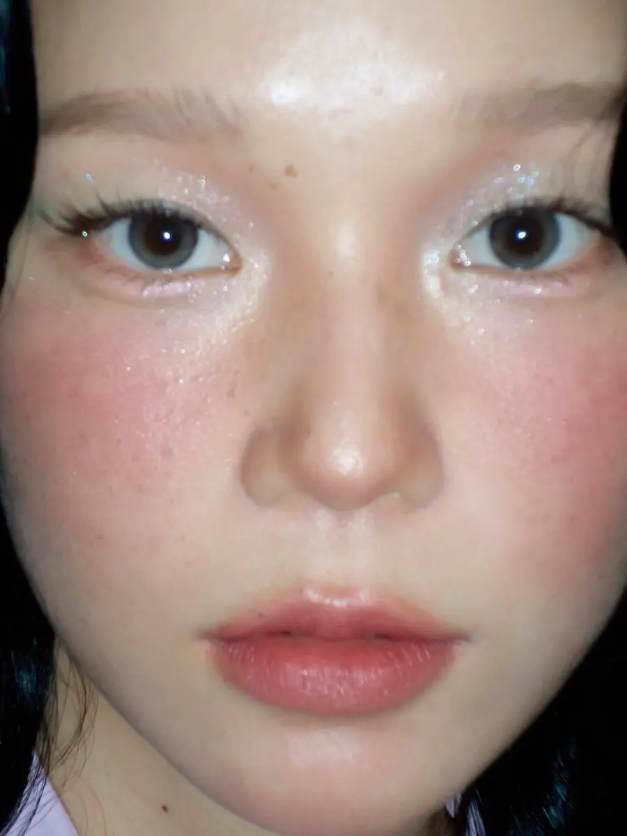 Glamorous doll makeup with a natural glow