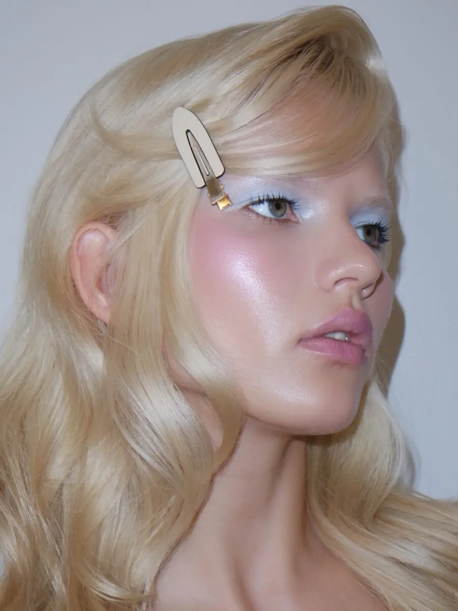 Playful doll-inspired makeup with soft pastels