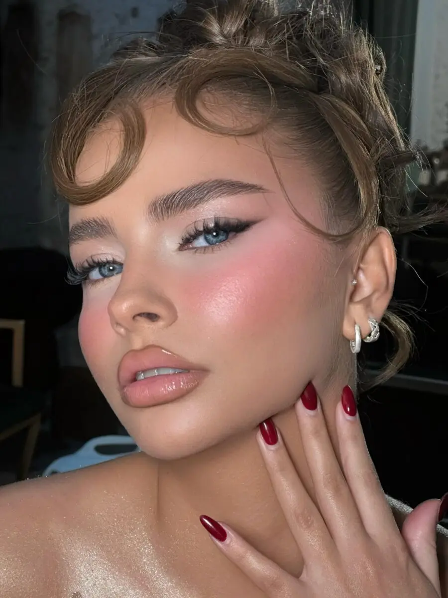 Glamorous doll-inspired makeup with a soft glow