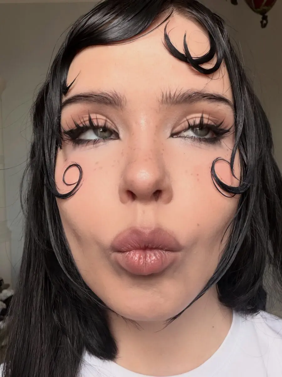Unique doll-inspired makeup with swirled details