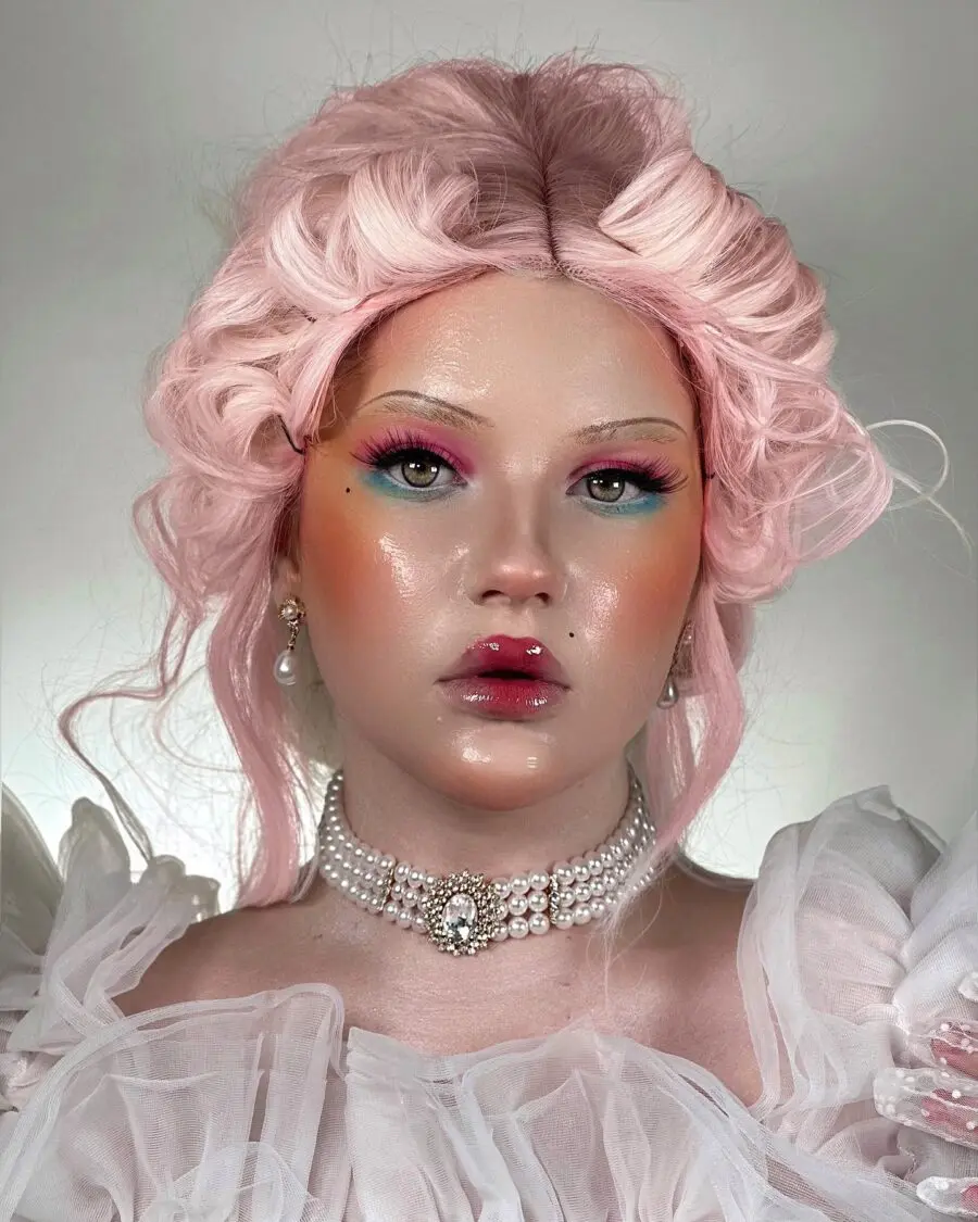 Vibrant doll makeup with pastel pink accents