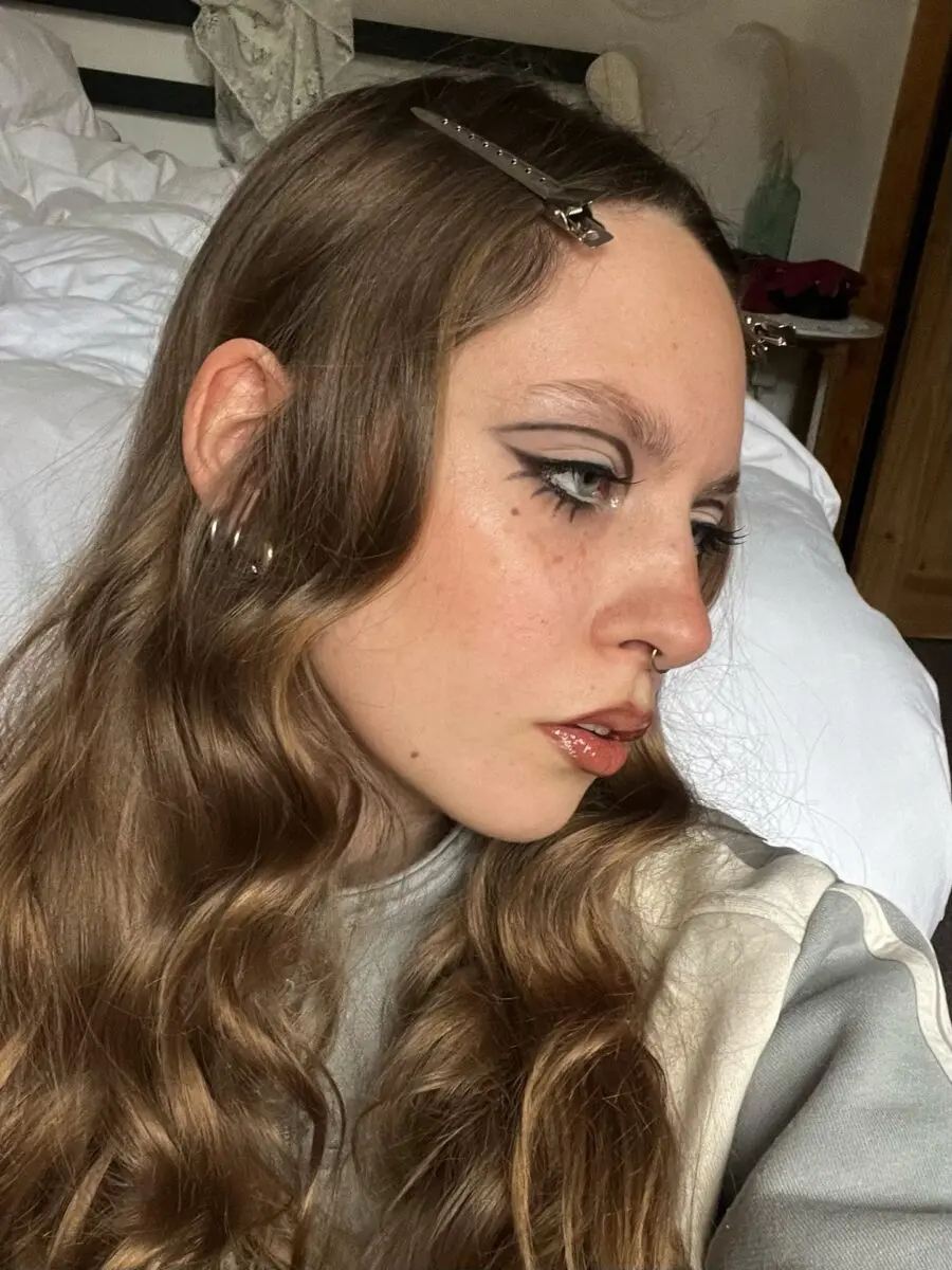 Chic doll-inspired makeup with bold accents