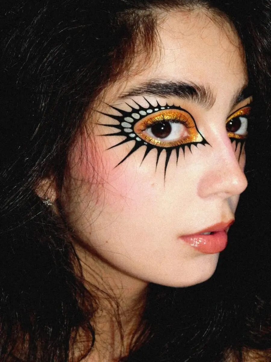 Vibrant sun-themed doll makeup artistry