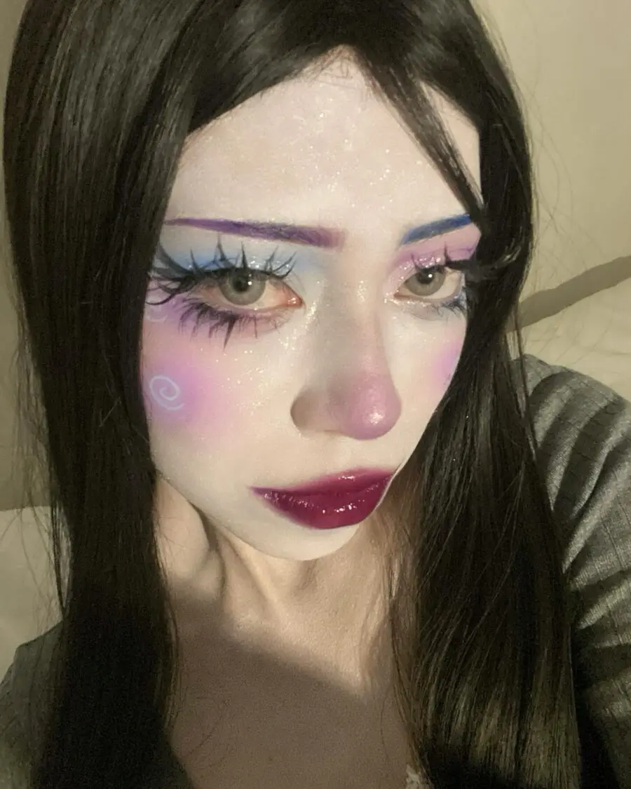 Whimsical doll-inspired makeup with vibrant colors