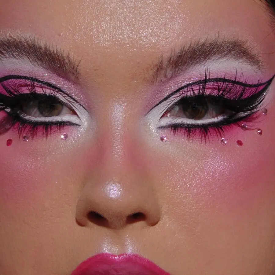 Glamorous doll makeup with vibrant pink accents