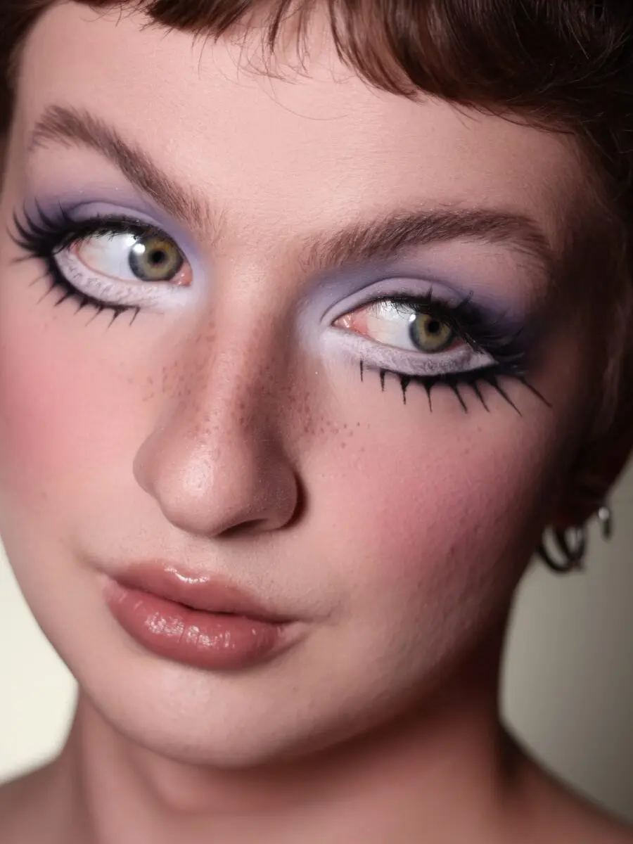 Whimsical Doll Makeup with Vibrant Purple Hues