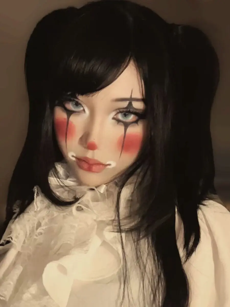 Dramatic doll makeup with clown influences.