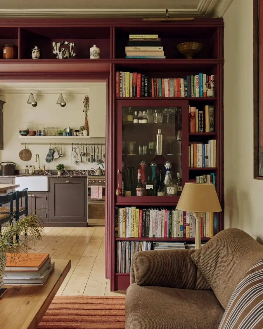 Charming bookshelf connecting living space and kitchen